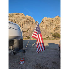 Load image into Gallery viewer, Heavy-duty flag mount securely holding a flag pole on a camper, built to withstand mild windy conditions.
